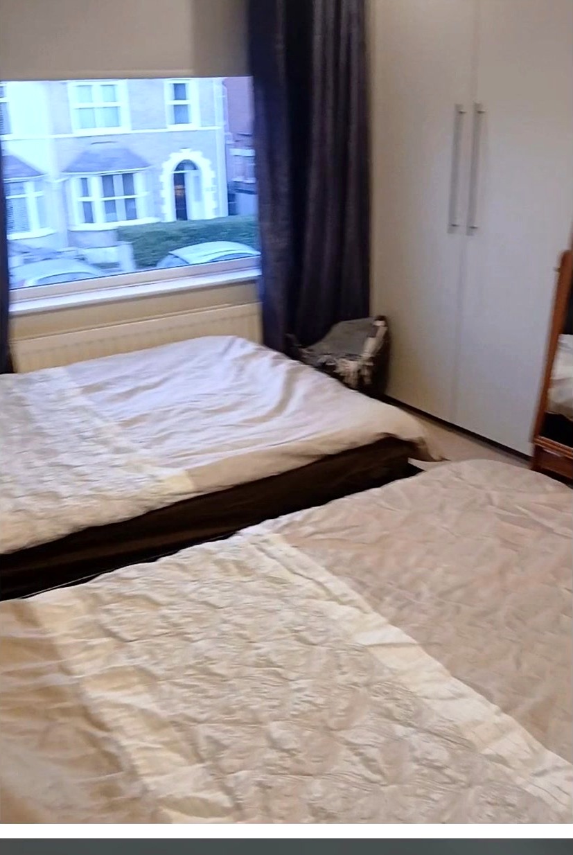 Neatly finished bedroom after cleaning by Good Hands
